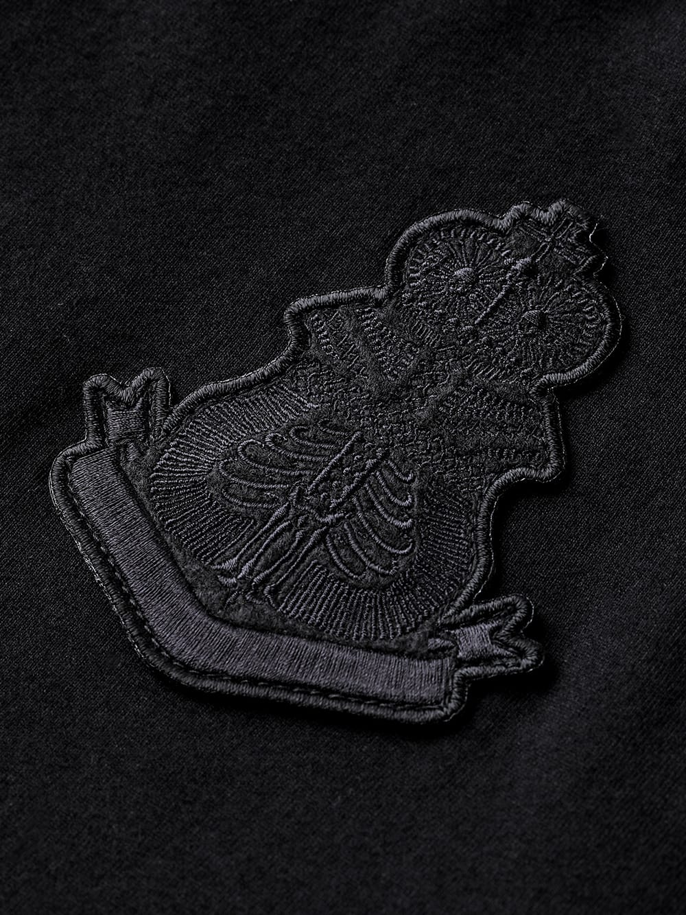 S logo and bone emblem. (s/s pocket tee)