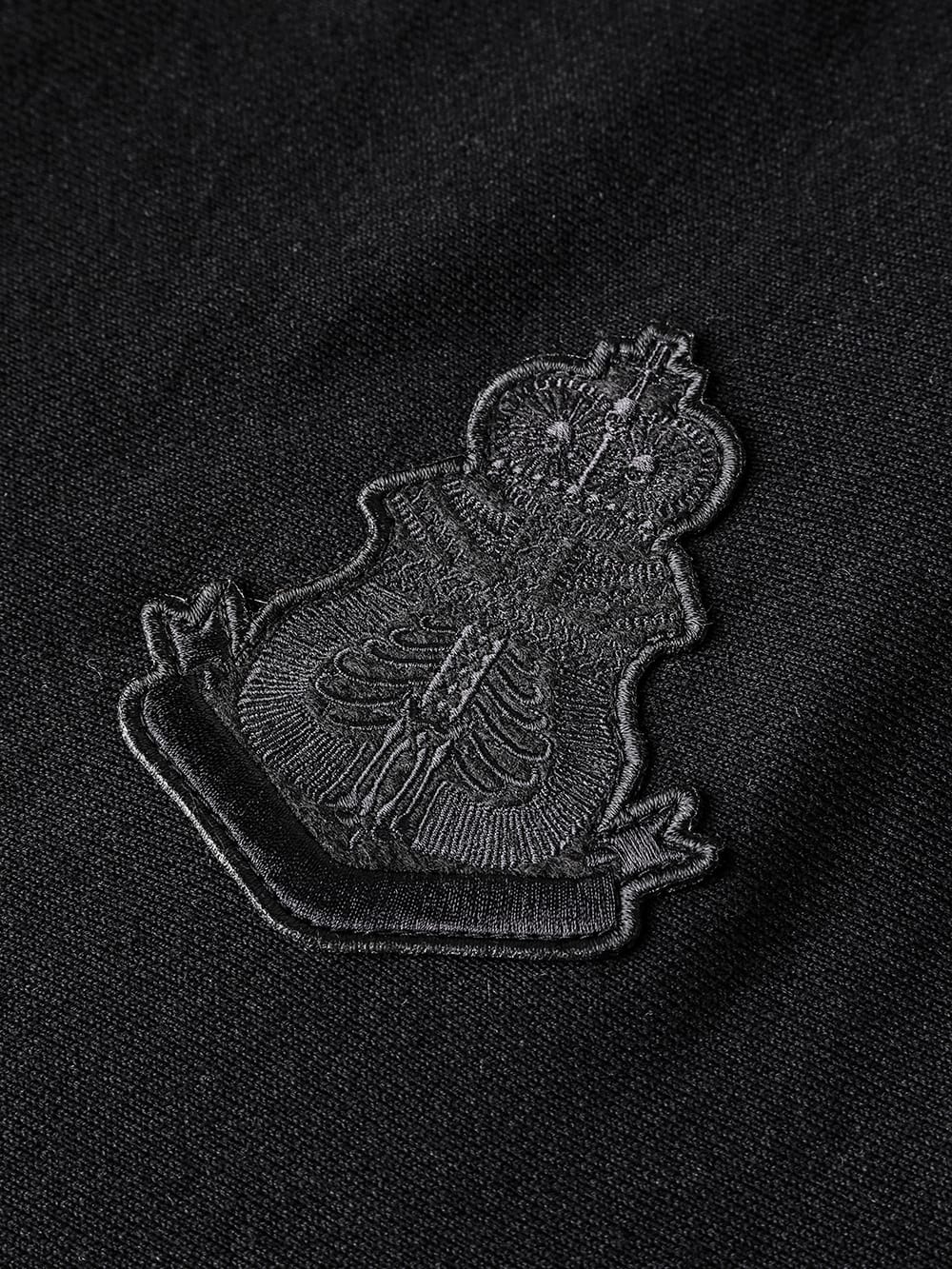 S logo and bone emblem. (oversized crew neck sweatshirt)